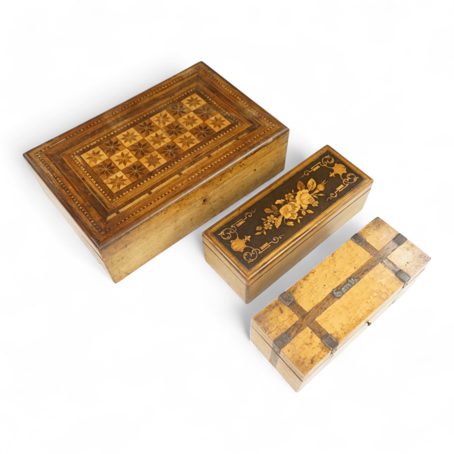 Three boxes comprising a Sorrento ware glove box, a marquetry inlaid slope and a rosewood dressing box, largest 39cm wide